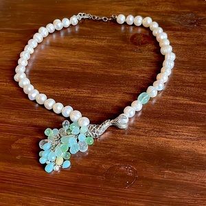 Freshwater pearl necklace with silver fish detail and sea foam green beads